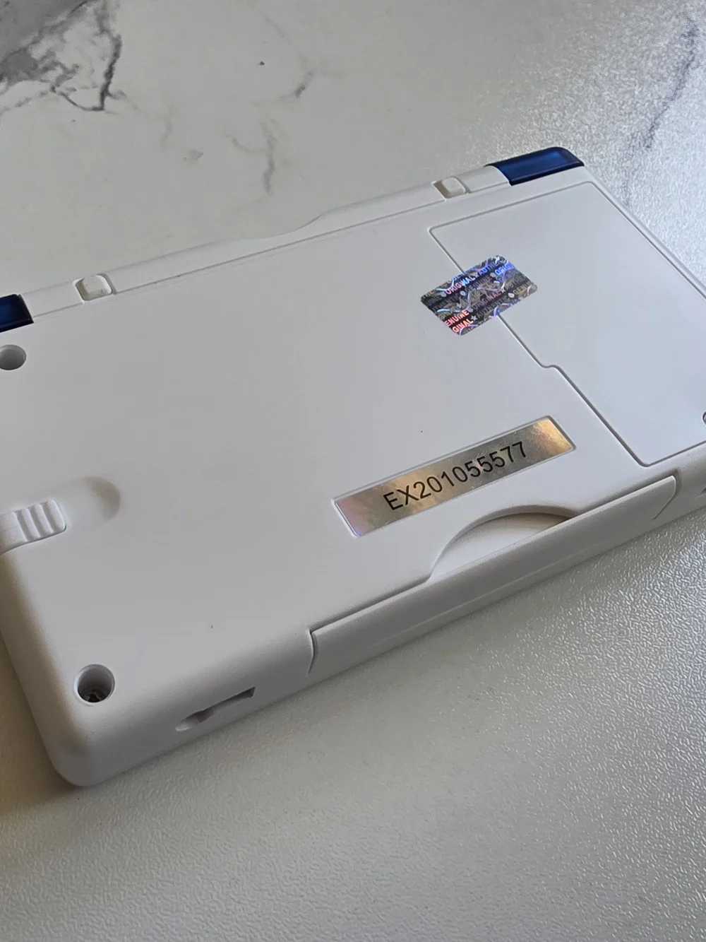 Nintendo White Handheld Console with Blue Controls